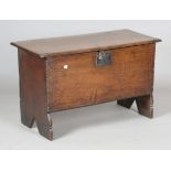 A small Charles II provincial oak six-plank boarded coffer, the notched edges with incised geometric