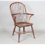 An early Victorian yew and elm stick back Windsor armchair with shaped panel seat and crinoline