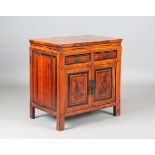 A Chinese softwood side cabinet, fitted with a pair of floral painted doors, height 71cm, width