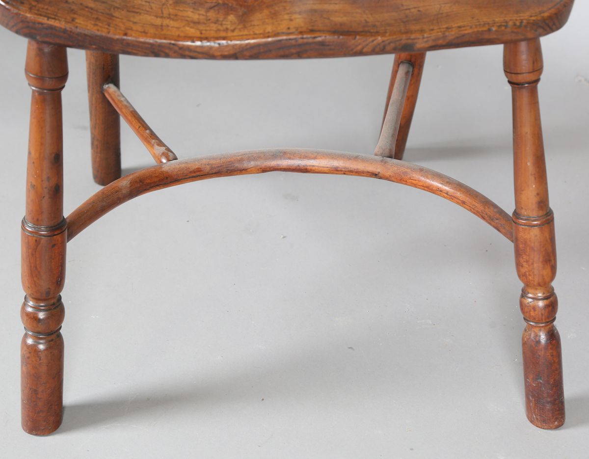 An early Victorian yew and elm stick and wheel back Windsor armchair with shaped panel seat and - Image 5 of 14