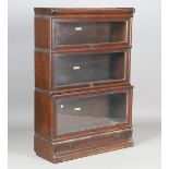 A George V oak Globe Wernicke graduated three-tier bookcase, fitted with a drawer to base, height