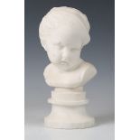 A late 19th/early 20th century carved white marble portrait bust of a young boy, raised on a