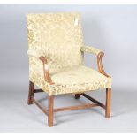 An early 20th century George III style mahogany Gainsborough armchair, the armrests carved