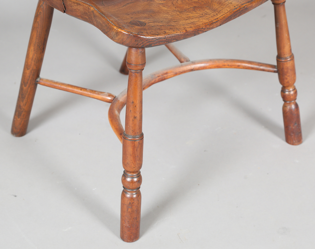 An early Victorian yew and elm stick and wheel back Windsor armchair with shaped panel seat and - Image 8 of 14