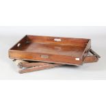 A 19th century mahogany butler's tray with galleried sides and folding stand, width 81cm, depth