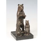 A 20th century brown patinated cast bronze figure group of a bear and two bear cubs, mounted as