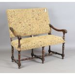 A late 19th/early 20th century Carolean Revival walnut framed hall settee with some period elements,