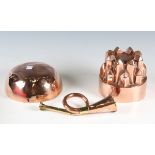 A Victorian copper jelly mould, diameter 14cm, a copper and brass hunting horn, length 21cm, and a