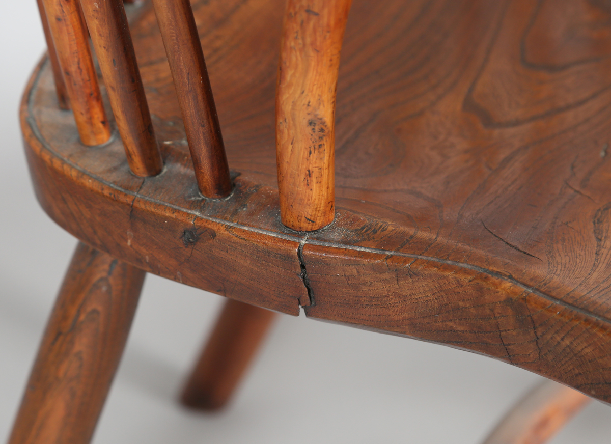 An early Victorian yew and elm stick and wheel back Windsor armchair with shaped panel seat and - Image 6 of 14