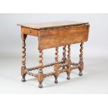 A Charles II walnut single drop-flap gateleg side table, fitted with two frieze drawers, on barley