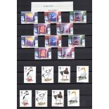 Great Britain decimal mint stamps in four albums plus presentation packs in two shoeboxes, some