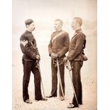 PHOTOGRAPHS. A collection of 21 photographs of men in military uniform, mounted on 12 leaves, each