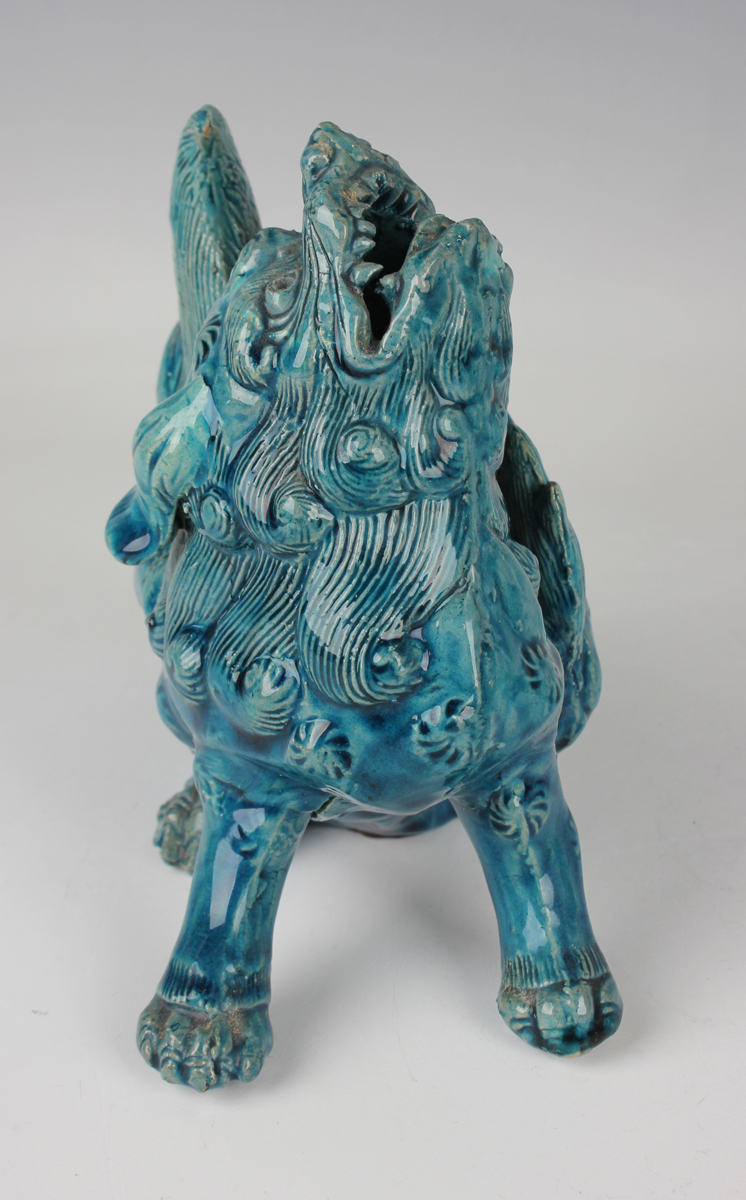 A pair of Chinese turquoise glazed models of Buddhistic lions, late 19th century, each modelled in a - Image 11 of 14