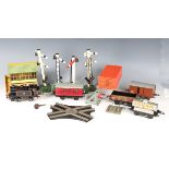 A collection of Hornby Series gauge O clockwork items, including three 0-4-0 tank locomotives 82011,