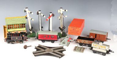 A collection of Hornby Series gauge O clockwork items, including three 0-4-0 tank locomotives 82011,