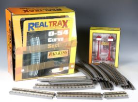 A collection of Rail King by MTH gauge O track and trackside accessories, including twenty 30-inch