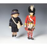 A felt doll with painted features, possibly of King Edward VIII, wearing a bear skin hat, red