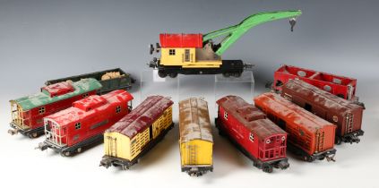 A collection of Lionel tinplate gauge O goods rolling stock, including No. 815 tanker, hopper