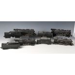 Four Lionel gauge O 3-rail electric steam locomotives and tenders with diecast bodies, comprising