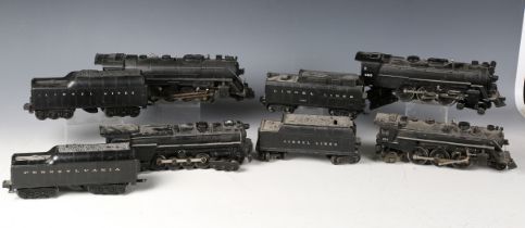 Four Lionel gauge O 3-rail electric steam locomotives and tenders with diecast bodies, comprising