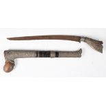 An early 20th century Malaysian kris dagger with swept single-edged blade, blade length 24.5cm,