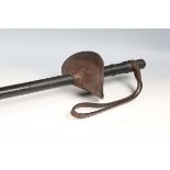 An early 20th century Mounted Police officer's leather sword baton, overall length 91cm, with