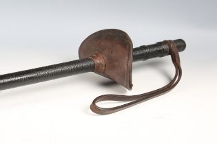 An early 20th century Mounted Police officer's leather sword baton, overall length 91cm, with