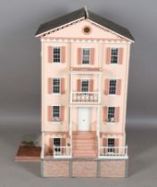 A modern Georgian style doll's townhouse, the double opening front hinged to reveal three rooms, the