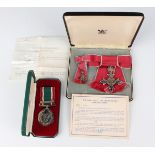 An MBE, civil issue, with a ribbon bow for lady's wear, the corresponding dress miniature award