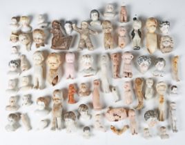 A large collection of bisque and porcelain dolls' socket heads, head and shoulders dolls' parts,