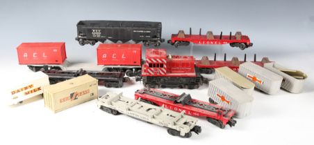 A good collection of Lionel gauge O plastic goods wagons, including car and boat loaders, trailer