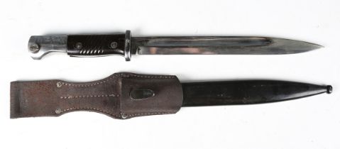 A post-war copy German K98 bayonet with single-edged fullered blade, blade length 25.5cm, the