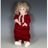 A Max Handwerck bisque head doll, impressed 'O1/4', with blonde wig, fixed blue glass eyes, open