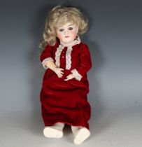 A Max Handwerck bisque head doll, impressed 'O1/4', with blonde wig, fixed blue glass eyes, open