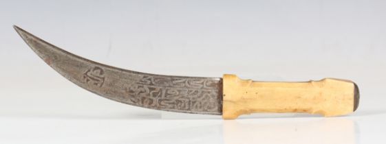 A small Middle Eastern dagger with curved blade, blade length 16cm, etched with script and mounted