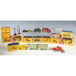 A small collection of Dinky Toys models, including No. 384 trade box and lid containing two grass