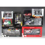 Four Minichamps 1:12 scale model racing motorcycles, comprising Honda RC211V Repsol Honda Team