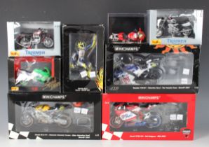 Four Minichamps 1:12 scale model racing motorcycles, comprising Honda RC211V Repsol Honda Team