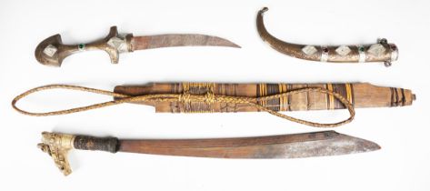 An early 20th century Dayak mandau with curved hatchet-section blade, blade length 43cm, and typical