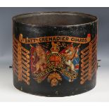 An early 20th century brass military drum body, the side painted with the Royal arms and military