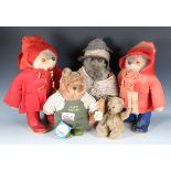 A Gabrielle Designs Aunt Lucy Bear, two Paddington Bears wearing red duffle coats, a Gardening