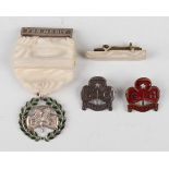 A Girl Guides Association green enamelled Medal of Merit, with ribbon and suspension bar,