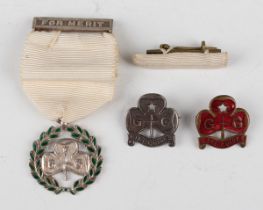 A Girl Guides Association green enamelled Medal of Merit, with ribbon and suspension bar,