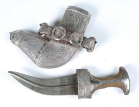 An early 20th century Middle Eastern jambiya with curved ribbed double-edged blade, blade length