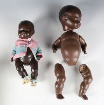 An Armand Marseille composition black baby doll, height 35cm, and a similar doll, height 26cm (