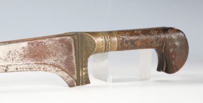 A 19th century Indo-Persian pesh-kabz with shaped deep-fullered blade, blade length 31cm, brass