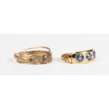 A late Victorian 18ct gold, sapphire and diamond ring, mounted with three sapphires alternating with