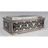 An Elizabeth II silver rectangular table cigarette box, designed by B.R. Cain, the stepped and