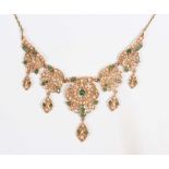 A gold, emerald and half-pearl fringe necklace, 1940s/50s, probably Indian, the front designed as