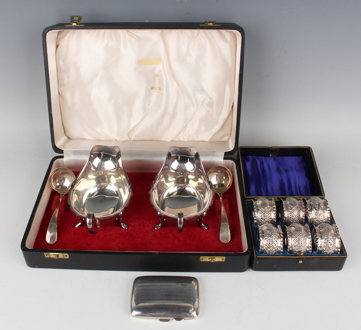 A pair of Elizabeth II silver sauceboats and a pair of silver sauce ladles, Sheffield 1964 and